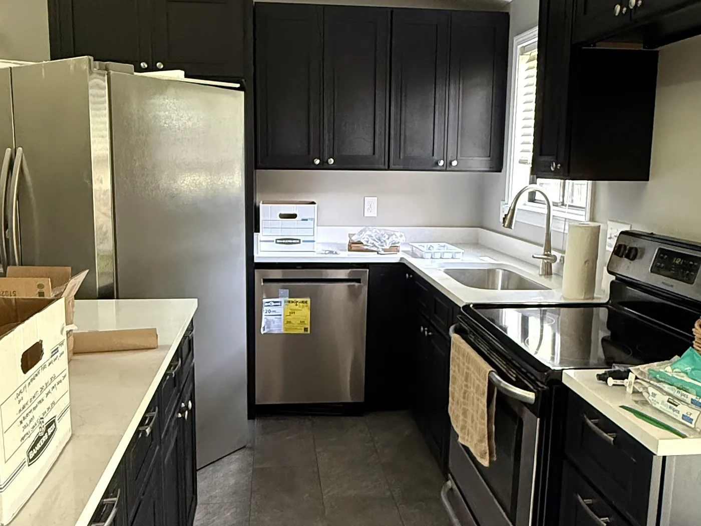 The same galley run with counters down and the range and dishwasher installed, still being fitted out.